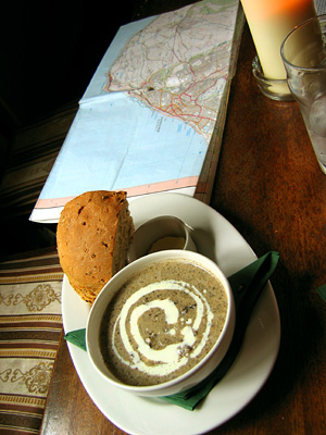 Mushroom soup, bowl, hunk of bread, roll, lunch, map, table, interior, Tiger Inn, pub, village, East Dean, East Sussex, England, Britain, UK, May 2007