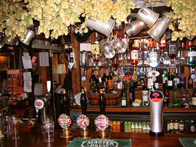 Bar interior at the Pepper Box Inn, Ulcombe, and dried hops